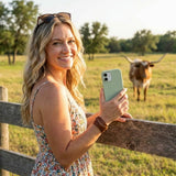 Sage Green iPhone 14 Case - Lifestyle photo showing phone case in use
