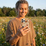 Seashell Monarch Butterfly iPhone 14 Case - Lifestyle photo showing phone case in use