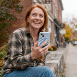 Powder Blue Slopes Calling iPhone 14 Case - Lifestyle photo showing phone case in use