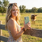 Sage Green iPhone 15 Pro Case - Lifestyle photo showing phone case in use