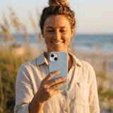 Powder Blue Ebb and Flow iPhone 15 Pro Case - Lifestyle photo showing phone case in use