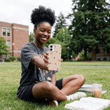 Seashell Lil Flutters iPhone 15 Pro Case - Lifestyle photo showing phone case in use