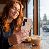 Seashell Lil Flutters Samsung Galaxy S25 Case - Lifestyle photo showing phone case in use