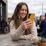 Honey Easy Breezy Frenchie Samsung Galaxy S25 Case - Lifestyle photo showing phone case in use