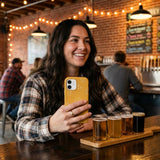 Honey Easy Breezy Frenchie iPhone 15 Case - Lifestyle photo showing phone case in use