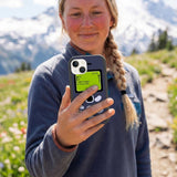 Black Mobile iPhone 14 Case - Lifestyle photo showing phone case in use