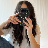 Black Galactic Glow Google Pixel 8 Case - Lifestyle photo showing phone case in use