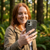 Black Astronomy iPhone 15 Pro Case - Lifestyle photo showing phone case in use