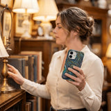 Black Space Waves iPhone 15 Case - Lifestyle photo showing phone case in use