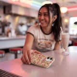 Seashell Garden Party iPhone 15 Pro Case - Lifestyle photo showing phone case in use