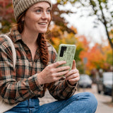 Sage Green Knit Nook Samsung Galaxy S25 Case - Lifestyle photo showing phone case in use