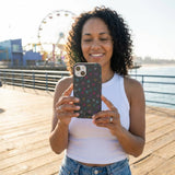 Black Neon Nostalgia iPhone 14 Case - Lifestyle photo showing phone case in use