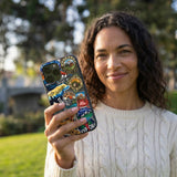 Black Trail Stickers iPhone 14 Case - Lifestyle photo showing phone case in use