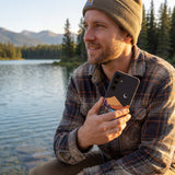 Black Night Trails Samsung Galaxy S25 Case - Lifestyle photo showing phone case in use