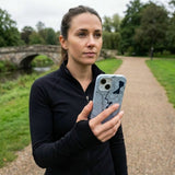 Powder Blue Contour Lines iPhone 14 Case - Lifestyle photo showing phone case in use