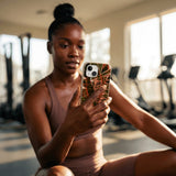 Seashell Foliage iPhone 15 Case - Lifestyle photo showing phone case in use