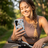 Powder Blue Chihuahua Charms Samsung Galaxy S25 Case - Lifestyle photo showing phone case in use