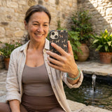 Black Beagle Buds iPhone 14 Case - Lifestyle photo showing phone case in use