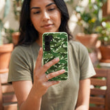Sage Green Dino Camo Samsung Galaxy S25 Case - Lifestyle photo showing phone case in use