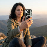 Black Vintage Camera iPhone 14 Case - Lifestyle photo showing phone case in use