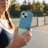 Sage Green Tennis Court iPhone 15 Pro Case - Lifestyle photo showing phone case in use