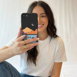 Black Night Trails iPhone 6/6s/7/8/SE Case - Lifestyle photo showing phone case in use