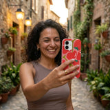 Bubblegum Pink Cherry Berry iPhone 14 Case - Lifestyle photo showing phone case in use