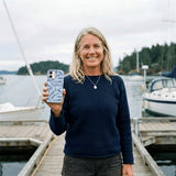 Powder Blue Fishery iPhone 14 Case - Lifestyle photo showing phone case in use