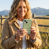 Sage Green Fairway iPhone 15 Pro Case - Lifestyle photo showing phone case in use