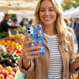 Electric Blue Dockside Dreams iPhone 15 Case - Lifestyle photo showing phone case in use