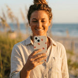 Seashell Lil Crabby iPhone 14 Case - Lifestyle photo showing phone case in use