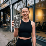 Black Mythical Dragons iPhone 14 Case - Lifestyle photo showing phone case in use