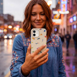 Seashell Tiny Amphibians iPhone 15 Case - Lifestyle photo showing phone case in use