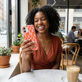 Bubblegum Pink Purr iPhone 15 Pro Case - Lifestyle photo showing phone case in use