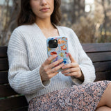 Powder Blue Dragon Cuties iPhone 13 Mini Case - Lifestyle photo showing phone case in use