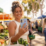 Powder Blue Gingham Farmhouse iPhone 15 Case - Lifestyle photo showing phone case in use