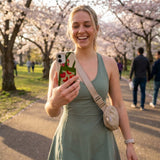 Seashell Market Tote iPhone 15 Pro Case - Lifestyle photo showing phone case in use