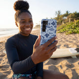 Powder Blue Marine Life Samsung Galaxy S25 Case - Lifestyle photo showing phone case in use