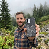 Black Night Panorama iPhone 16 Case - Lifestyle photo showing phone case in use