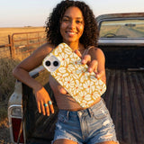 Honey Funky Petals iPhone 16 Pro Case - Lifestyle photo showing phone case in use