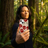 Seashell Scary Cherry iPhone 14 Case - Lifestyle photo showing phone case in use