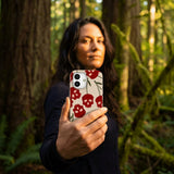 Seashell Scary Cherry iPhone 16 Pro Case - Lifestyle photo showing phone case in use