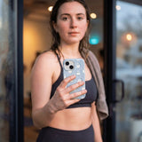 Powder Blue Ghostly iPhone 16 Case - Lifestyle photo showing phone case in use