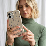 London Fog Petite Perennials iPhone 16 Case - Lifestyle photo showing phone case in use