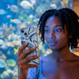 Powder Blue Whales iPhone 16 Pro Case - Lifestyle photo showing phone case in use