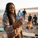 Electric Blue Sea Cows iPhone 16 Case - Lifestyle photo showing phone case in use