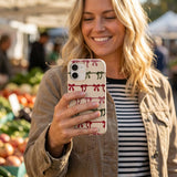 Seashell Holiday Bows iPhone 16 Pro Case - Lifestyle photo showing phone case in use