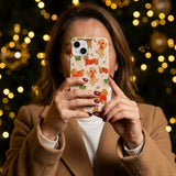 Seashell Jolly Doggos iPhone 14 Case - Lifestyle photo showing phone case in use