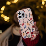 Seashell Holiday Lights iPhone 16 Pro Case - Lifestyle photo showing phone case in use