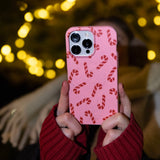 Bubblegum Pink Candy Cane Chaos iPhone 16 Pro Case - Lifestyle photo showing phone case in use
